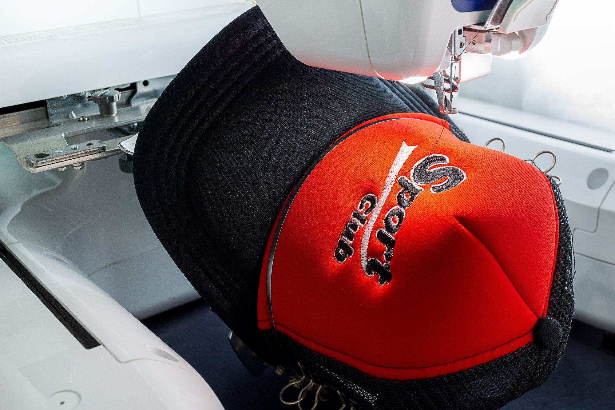 EmbroTech — precision embroidery studio logo