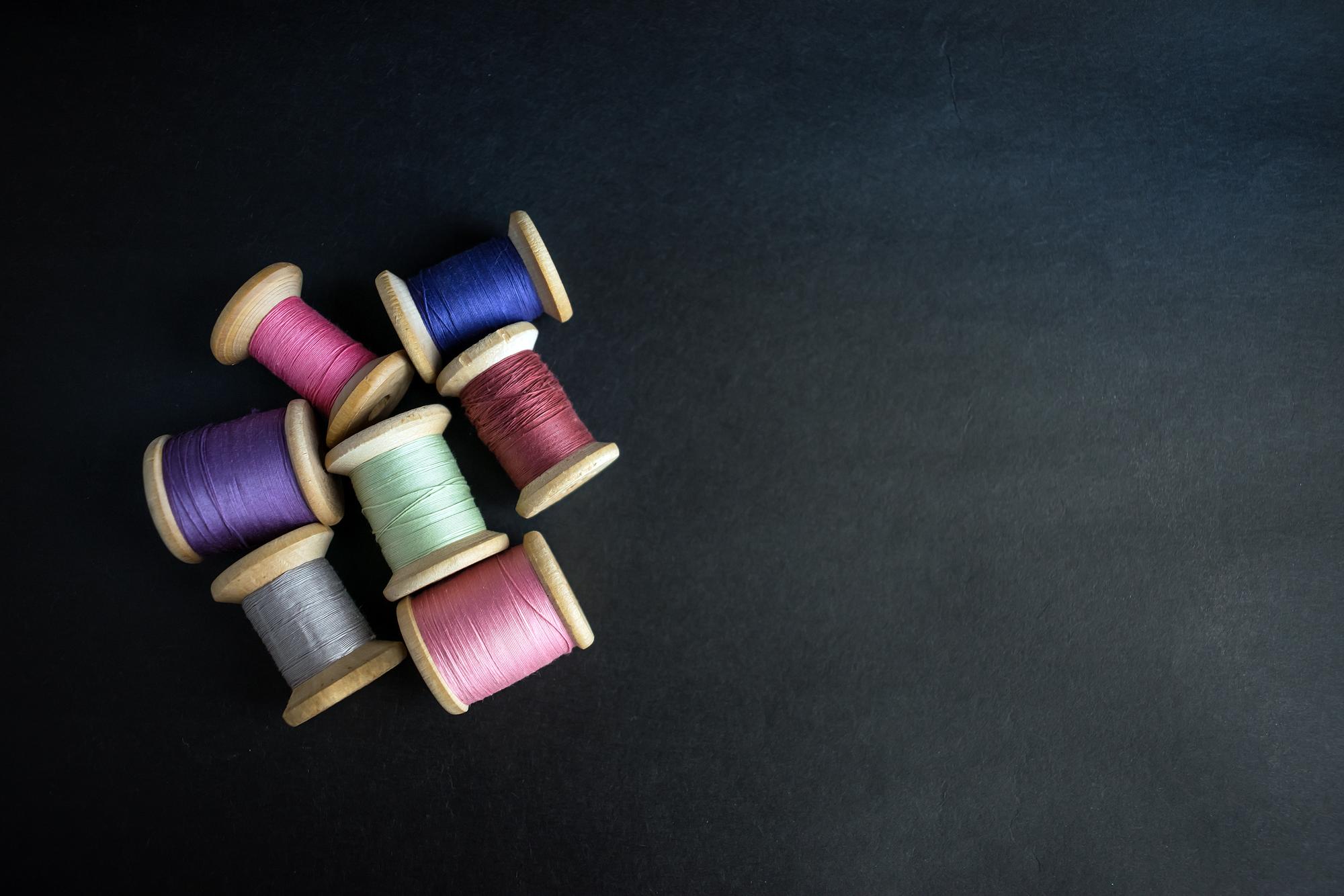 flatlay of thread spools and sample swatches