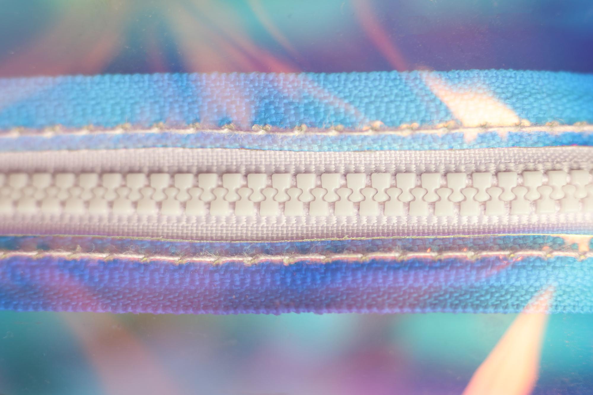 close-up futuristic embroidered patch with metallic threads